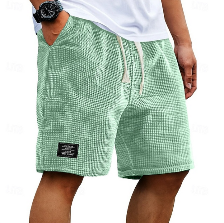 Sage green waffle-knit summer shorts with cream drawstring waistband
