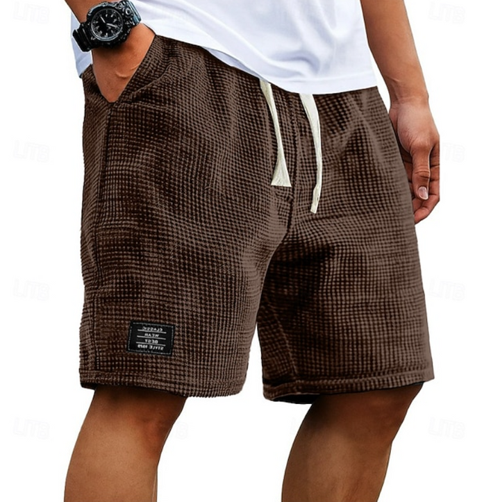 Brown waffle-knit casual shorts with cream drawstring and side pockets