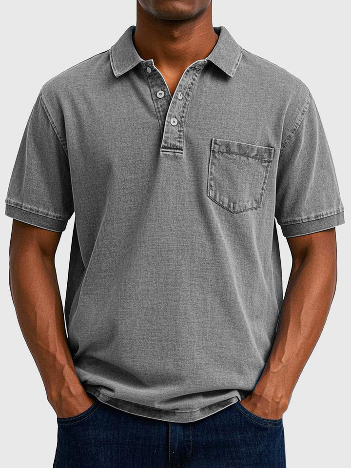 Grey washed denim polo shirt featuring short sleeves and chest pocket