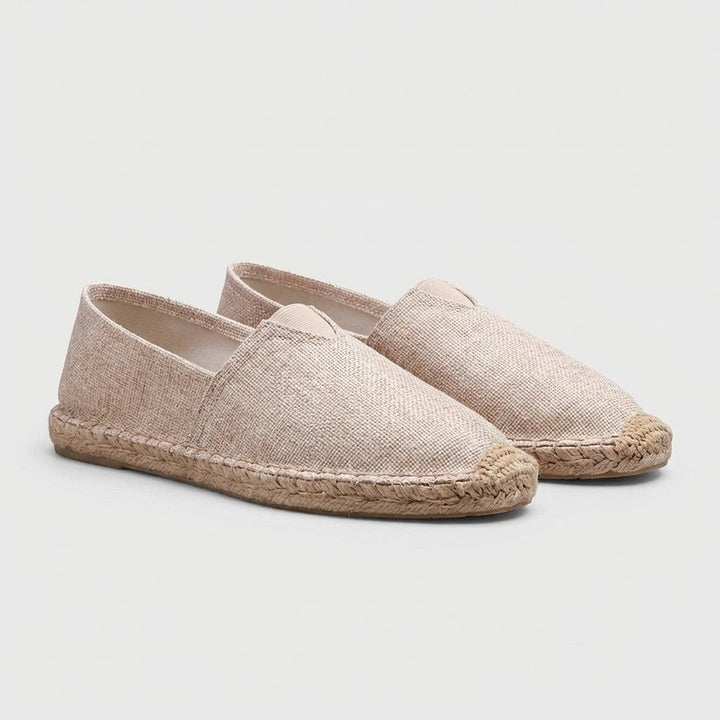 Beige linen espadrilles with braided jute trim, shown as a pair