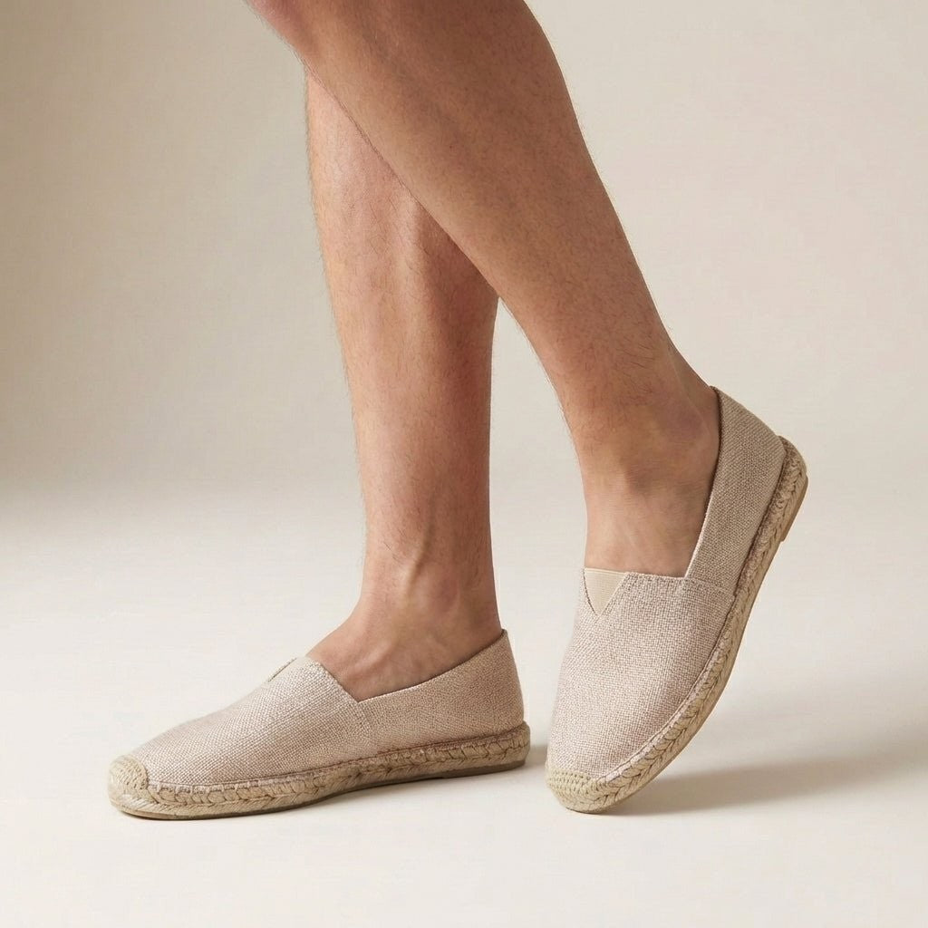 Natural beige espadrilles with elasticated heel gusset, worn on feet