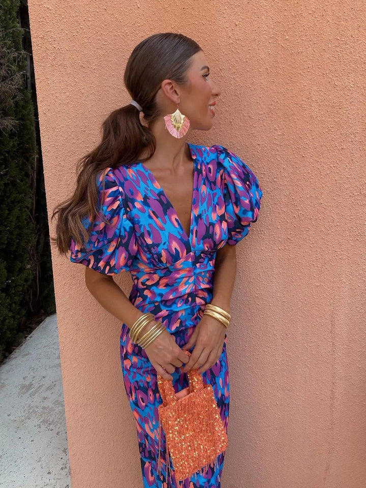 Blue and purple abstract leopard-print dress featuring puff sleeves and plunging neckline
