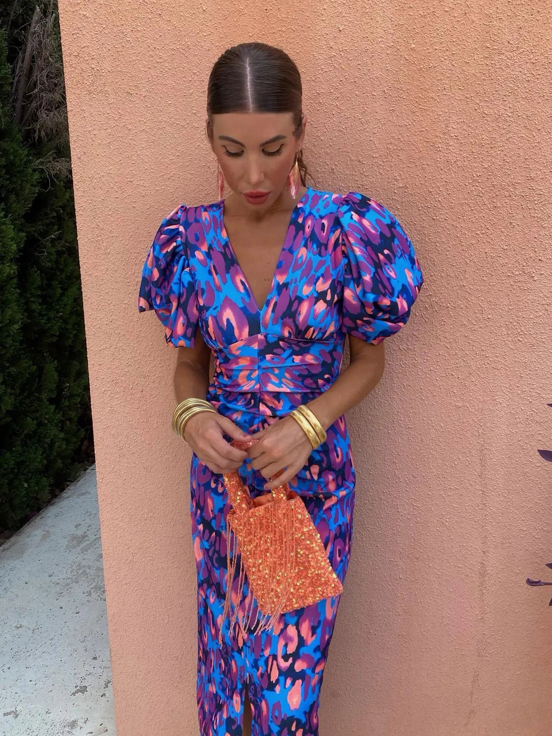 Close-up of puff sleeve midi dress in blue and purple animal print with V-neck