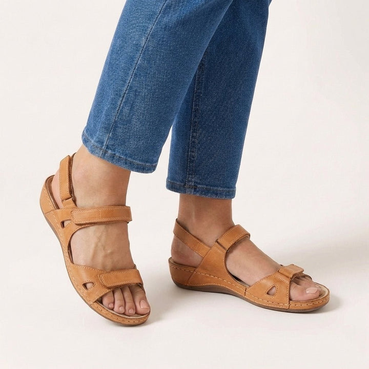 Tan leather orthopedic sandals featuring adjustable straps and cushioned footbed