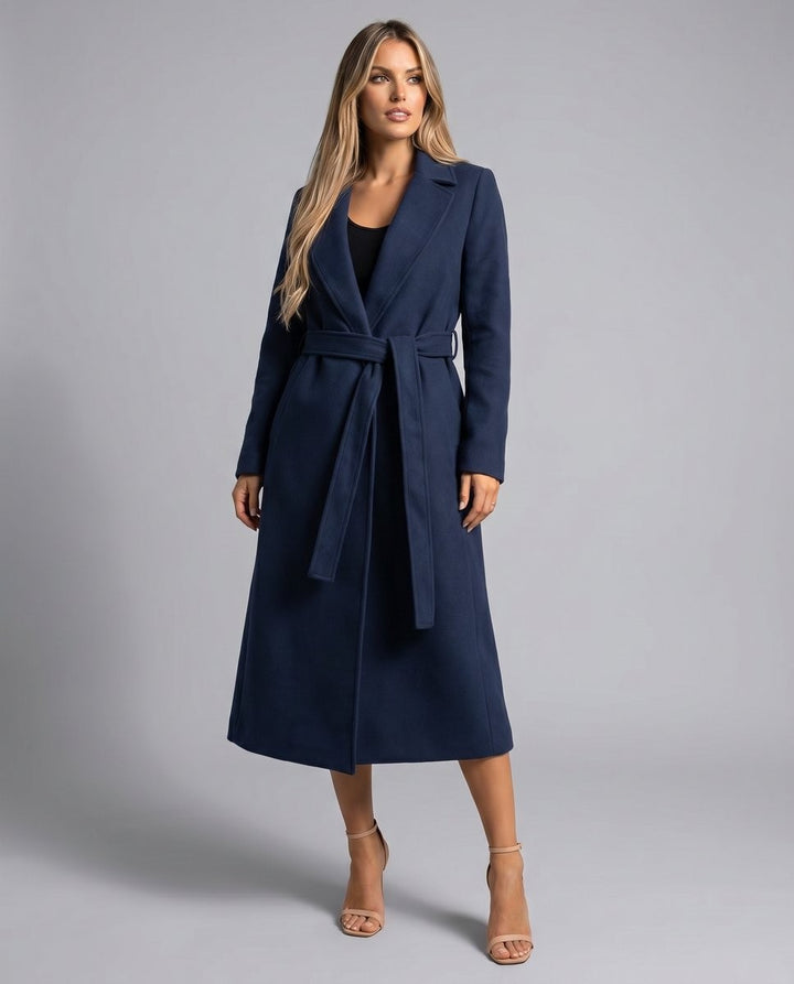 Navy longline wool coat with tie belt, worn open over a black top and heels