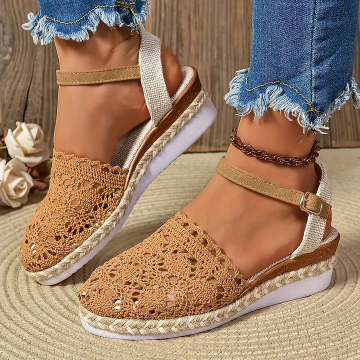 Sole view of cream espadrille wedge sandal showing ribbed white platform