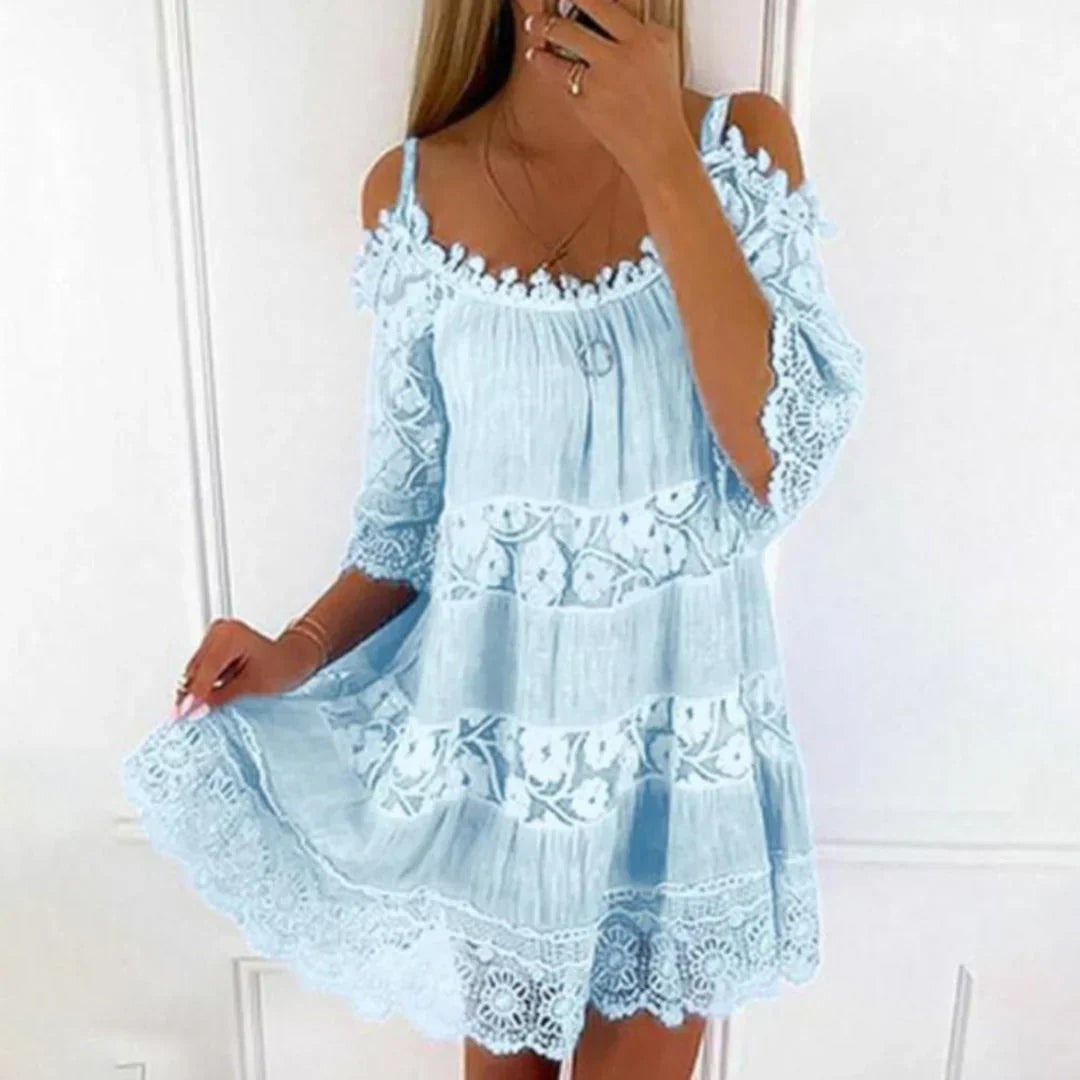 Pastel blue cold-shoulder mini dress with crochet trim and flowing tiered skirt