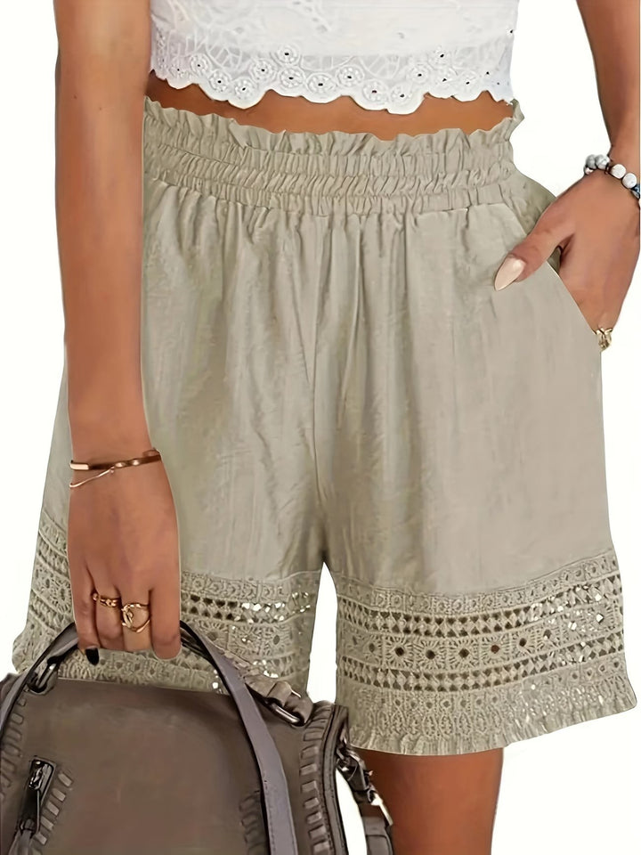 Sage green paperbag-waist shorts with crochet lace hem and side pockets