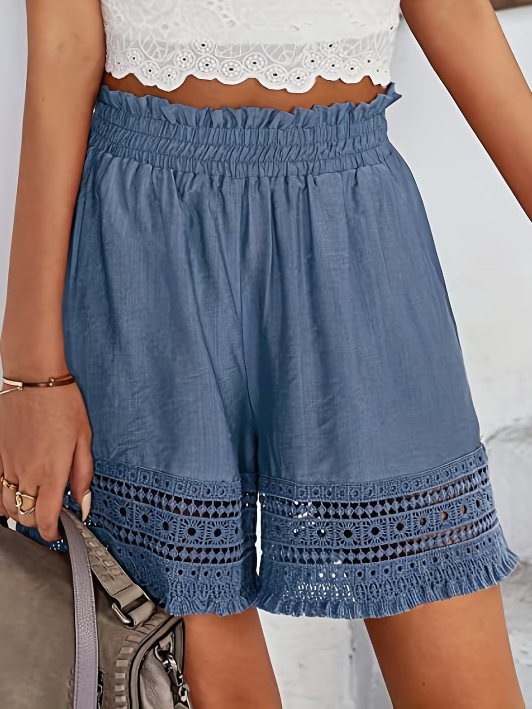 Denim-blue paperbag shorts with crochet lace hem and elasticated waist