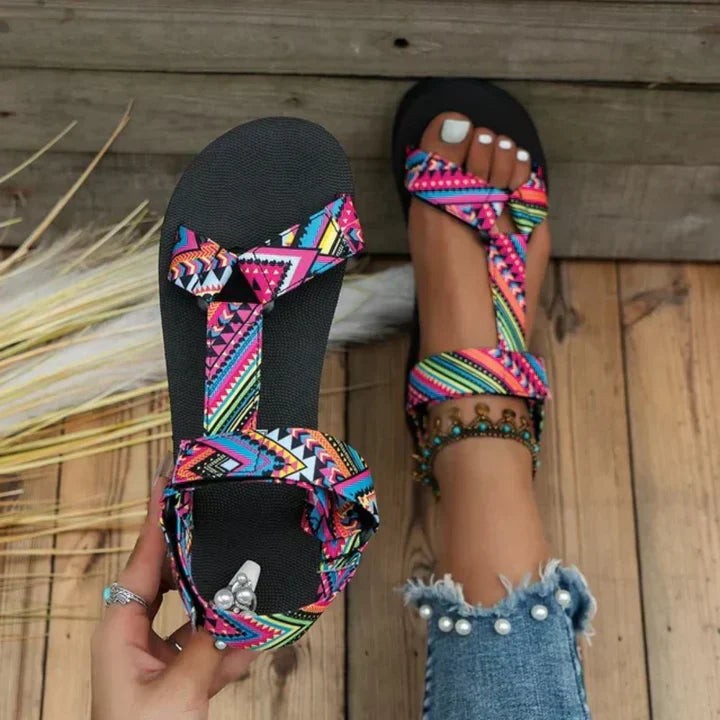 Vibrant pink and blue Aztec-print sandals with knotted strap detail and flatform sole