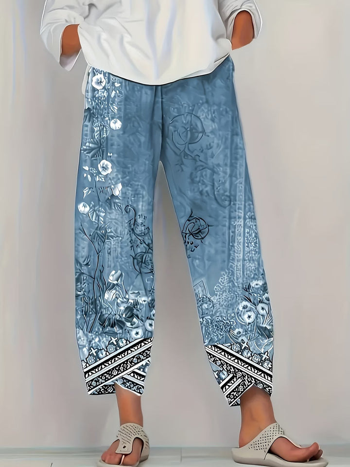 Slate blue vintage botanical print trousers with tapered tribal hem