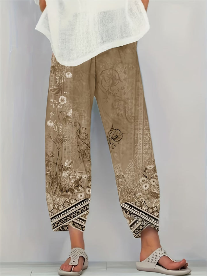 Taupe vintage floral print trousers with contrast geometric border cuffs