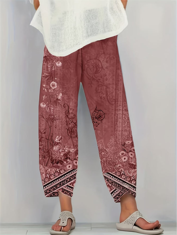 Dusty rose floral print harem trousers with black tribal trim hem