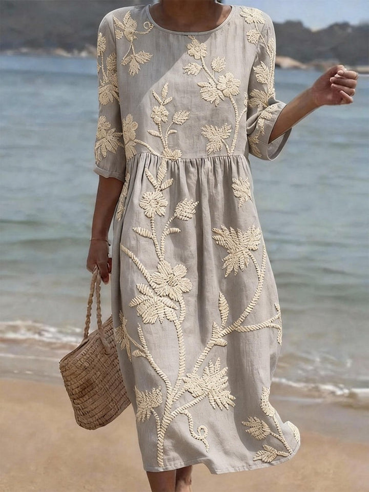 Grey embroidered midi dress with floral vine detailing and gathered waist