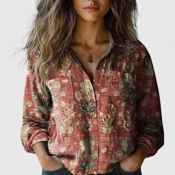 Rust red floral print blouse with button-up front and long sleeves