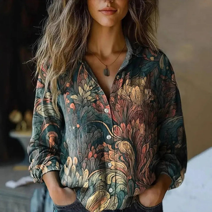Dark floral print blouse in teal and coral tones with button-up front