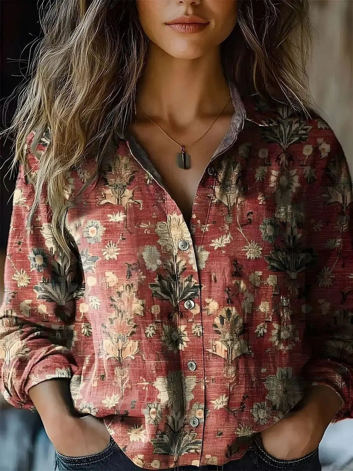 Rust floral print blouse with vintage-style pattern and long sleeves