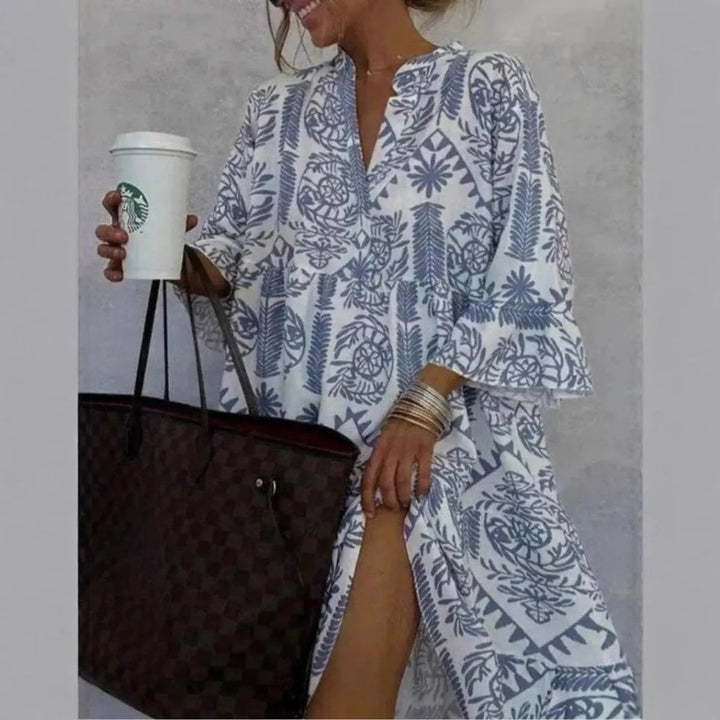 Blue paisley tunic dress featuring V-neckline and side split detail