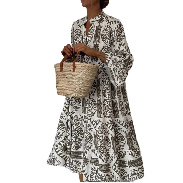 Khaki paisley print tunic dress with tiered hem and straw basket