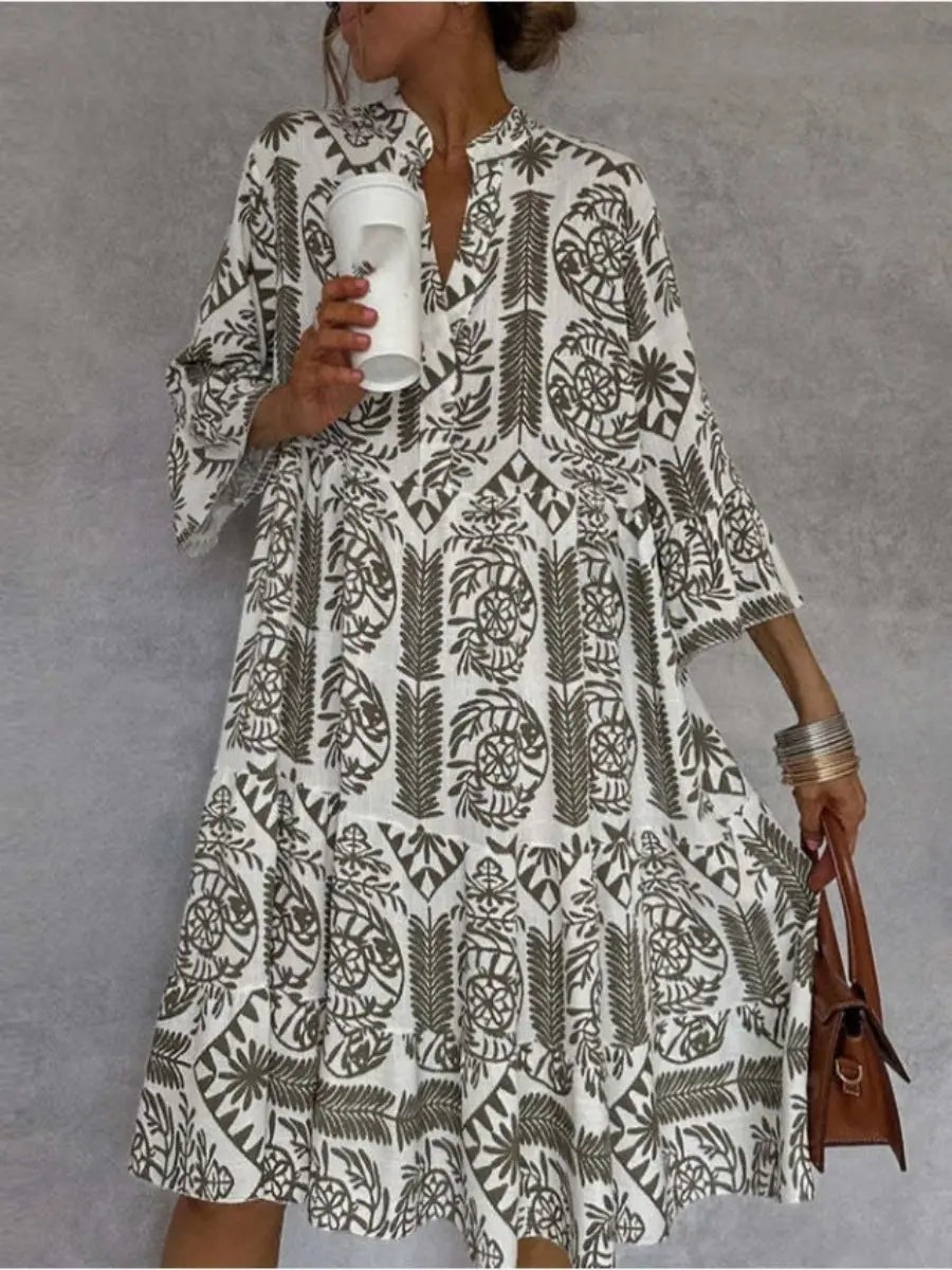 Olive green floral tunic dress showing flared bell sleeves close up