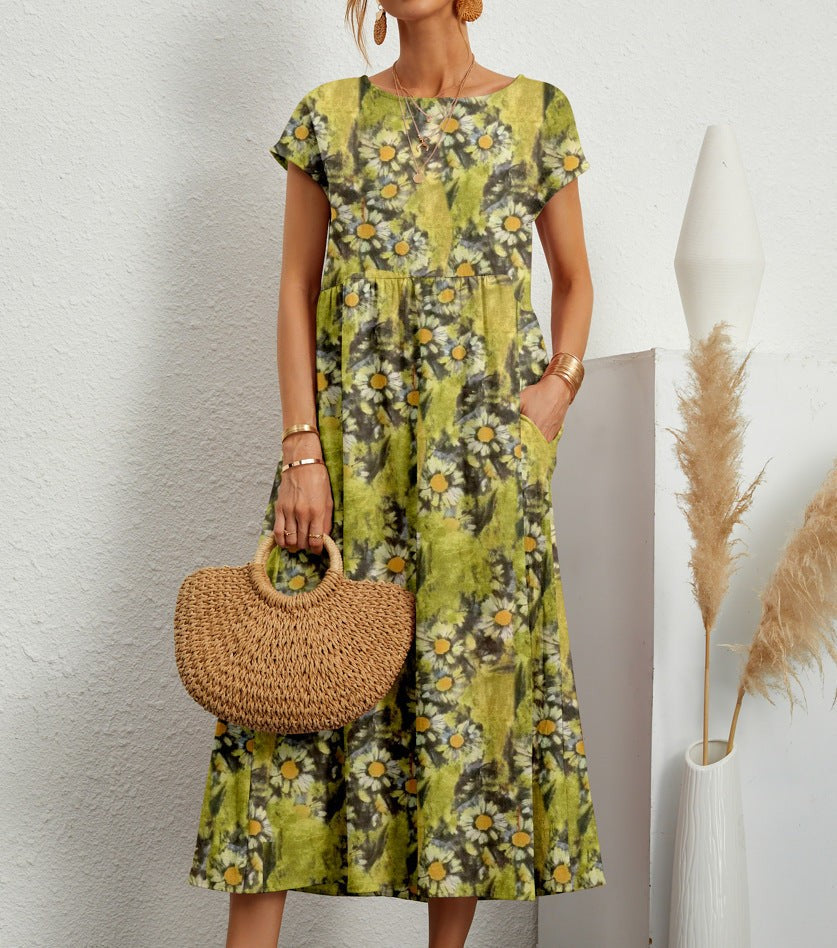 Green daisy print midi dress with round neckline and short sleeves