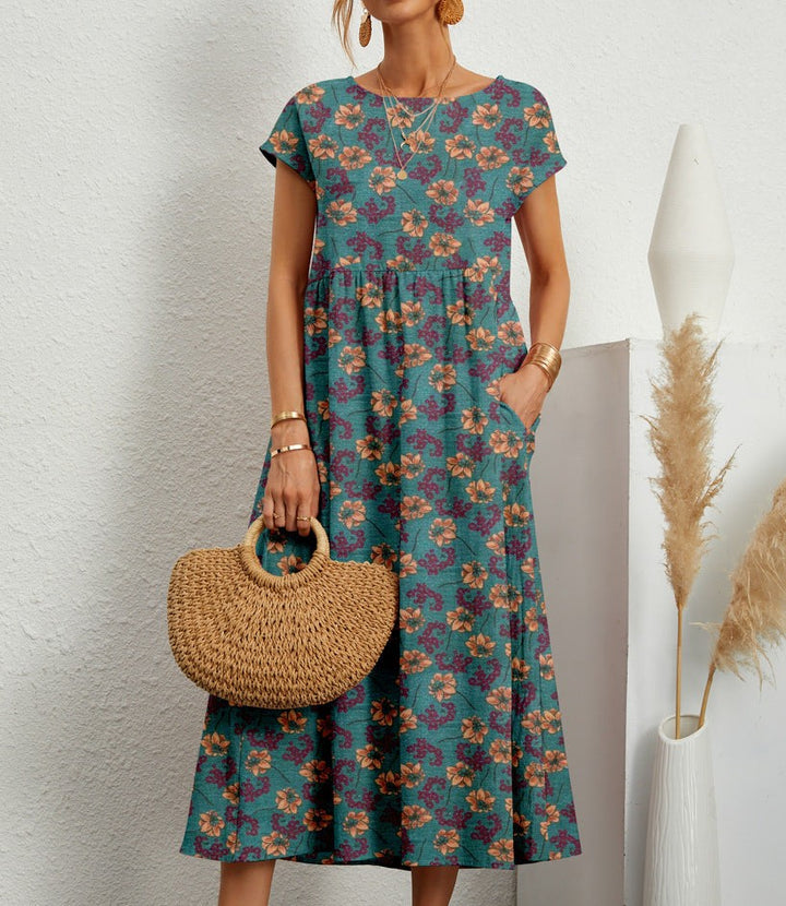 Teal floral midi dress with cap sleeves and relaxed tiered skirt