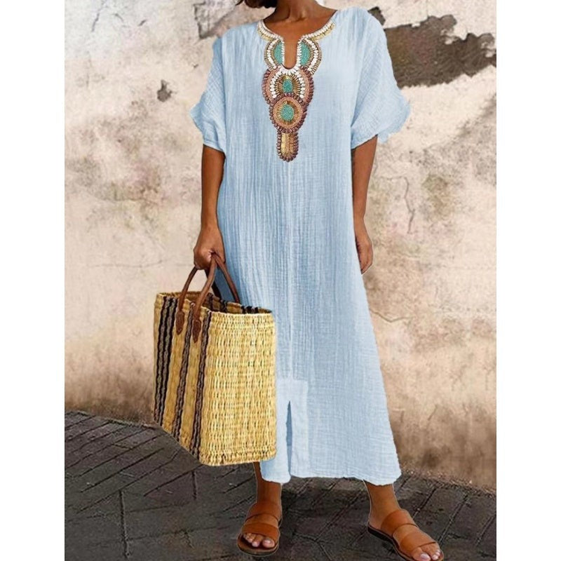 Pale blue kaftan-style maxi dress with beaded embroidered v-neck trim
