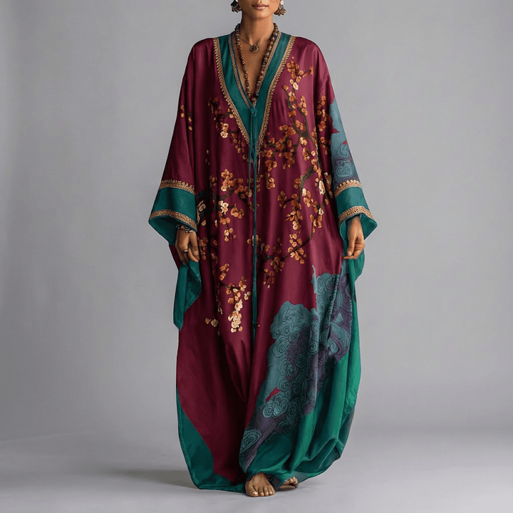 Burgundy kaftan dress featuring floral blossom print and teal batwing sleeves