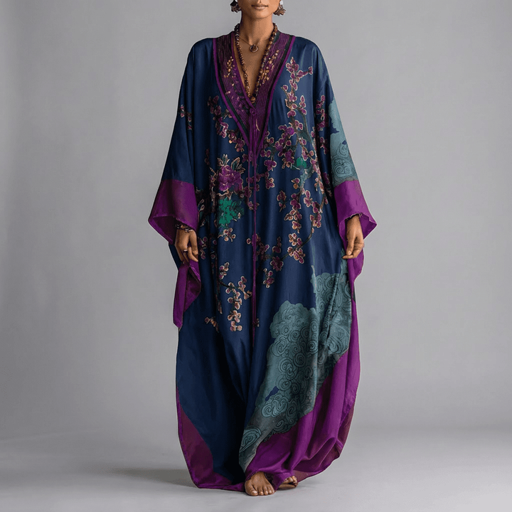 Navy kaftan maxi dress with purple blossom print and flowing batwing sleeves