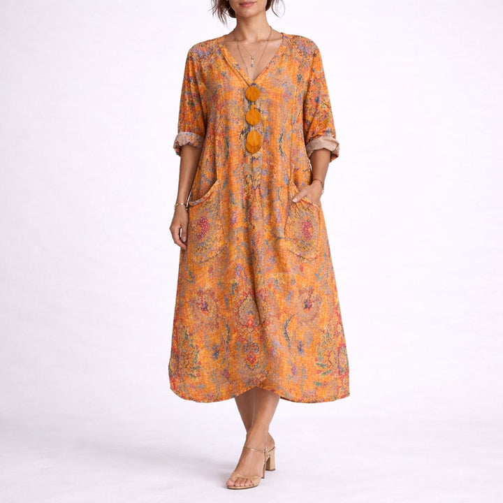 Orange bohemian print flowy maxi dress with three-quarter sleeves