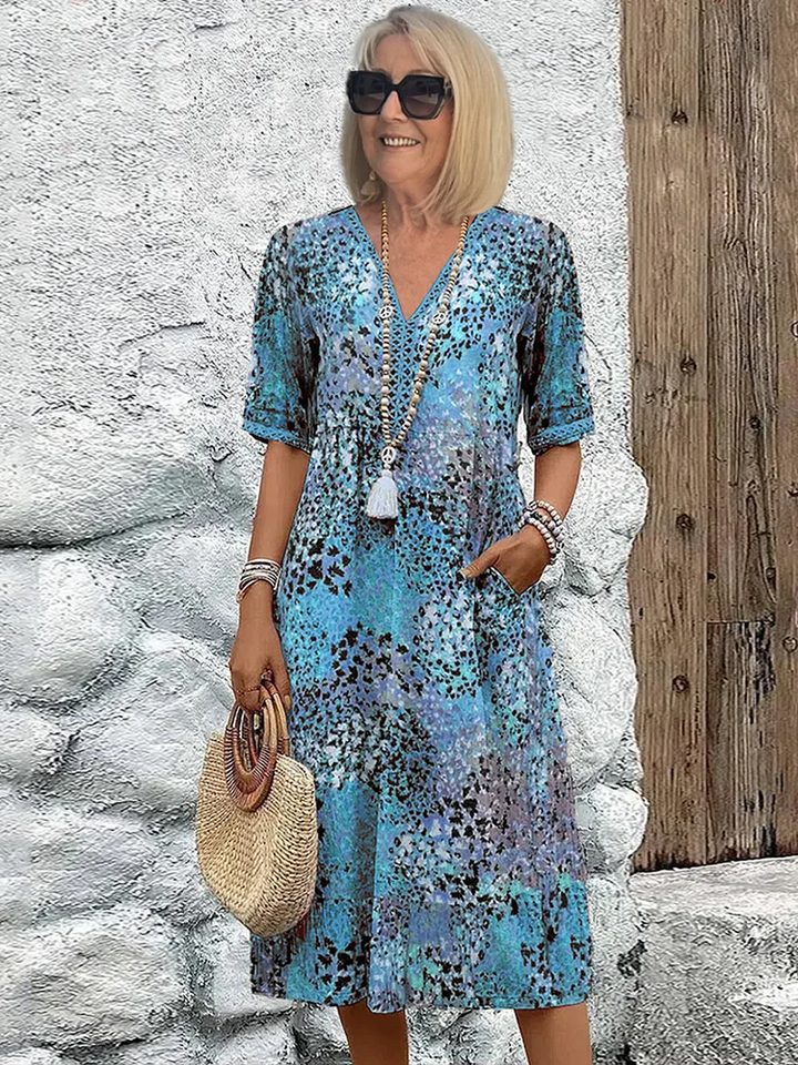 Blue patchwork print midi dress with crochet-trimmed V-neck and half sleeves