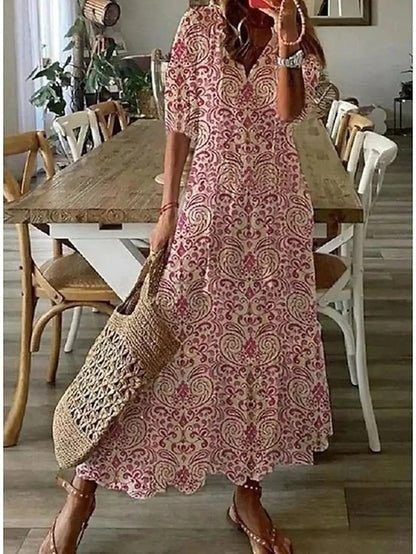 Pink and cream paisley-print maxi dress with flowing silhouette and tie neckline