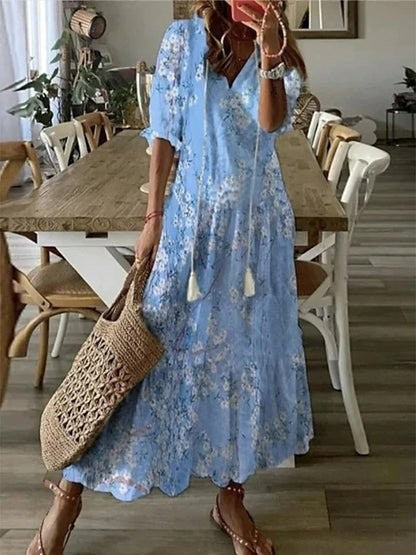 Pale blue floral-print maxi dress with tasselled neckline and relaxed boho fit
