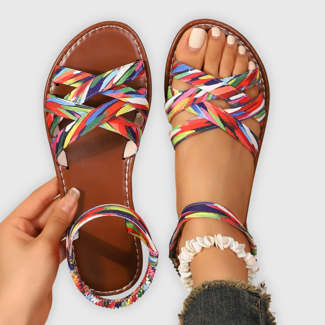 Multicoloured woven strap flat sandals with criss-cross front and elasticated ankle strap