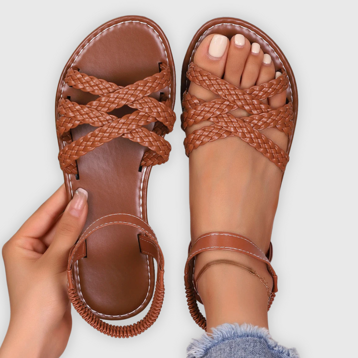 Tan braided leather flat sandals with crossover straps and elasticated ankle strap