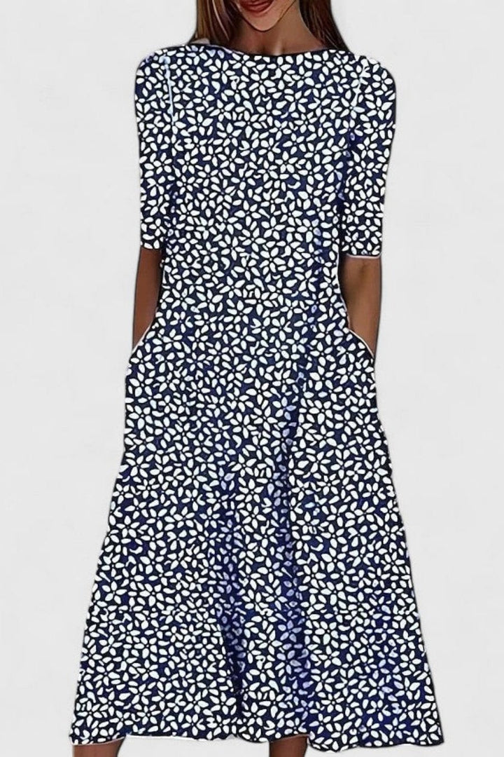 Navy midi dress with white floral print, short sleeves and side pockets