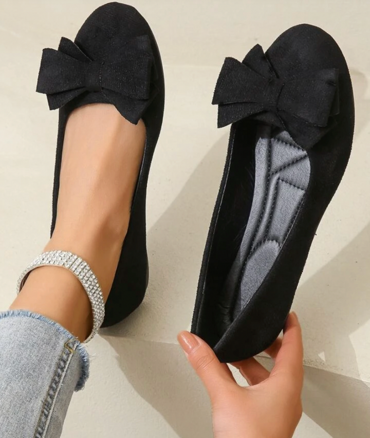 Black suede-effect ballet flats with layered bow detail and cushioned insole