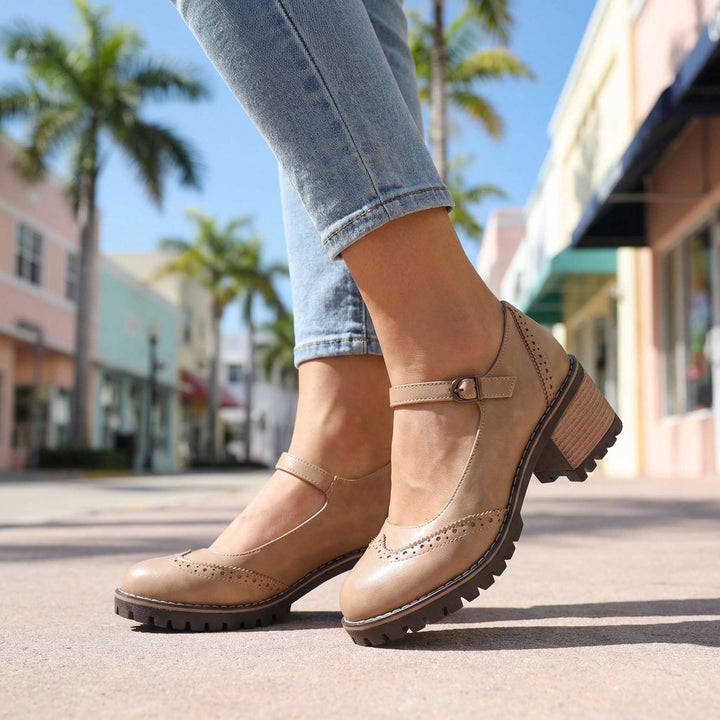 Beige brogue Mary Jane pumps with buckle fastening and cleated sole