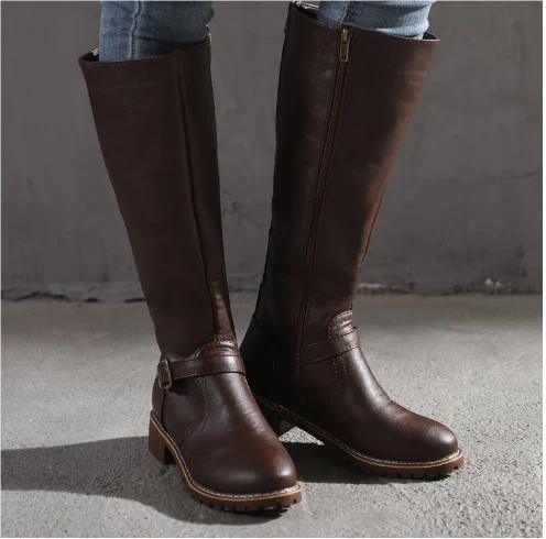 Brown leather knee-high boots featuring buckle detail and chunky sole