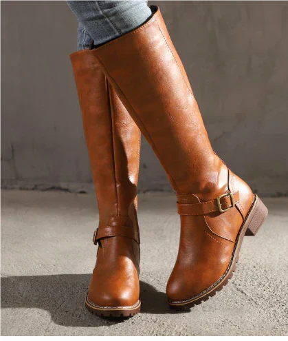 Tan leather knee-high boots with double buckle straps and stacked heel