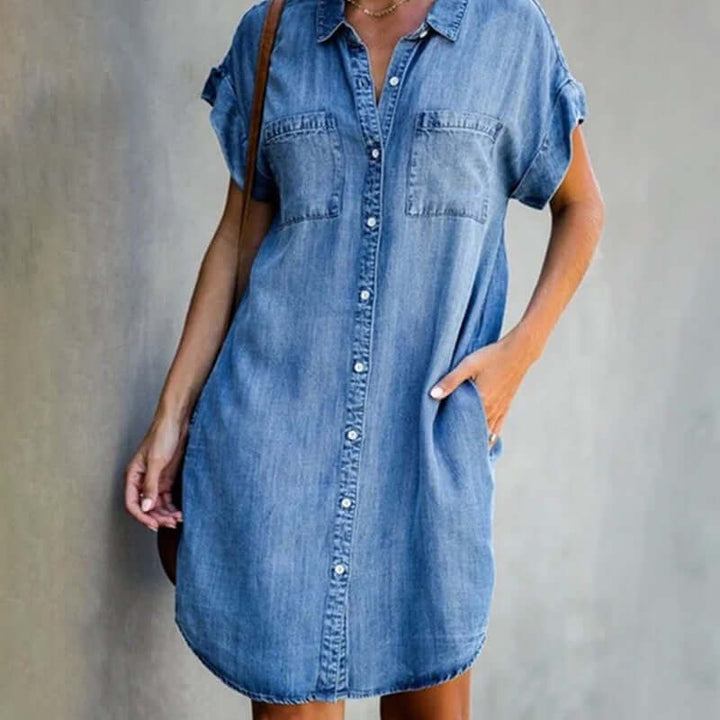 Light-wash denim shirt dress with short sleeves and twin chest pockets