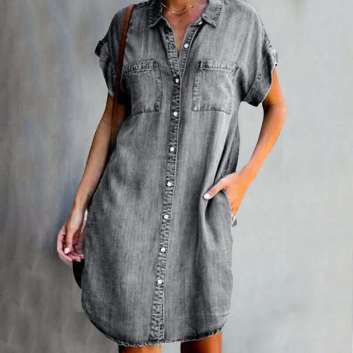 Grey denim button-through mini dress featuring turned-up cuffs and pockets