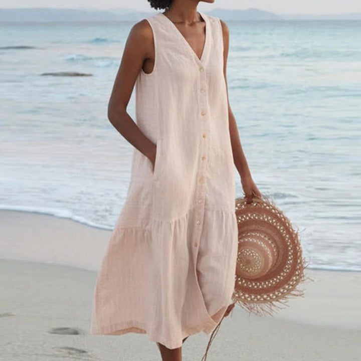 Beige linen sleeveless shirt dress with V-neckline and relaxed midi silhouette