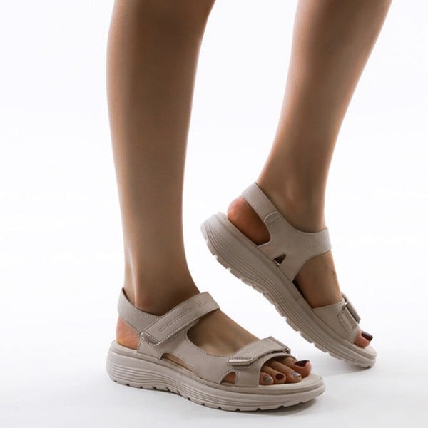 Side view of beige orthopedic sandals showing thick platform sole