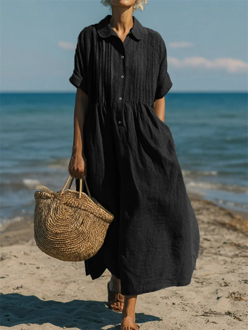 Black collared shirt dress with pleated bodice styled for a coastal stroll