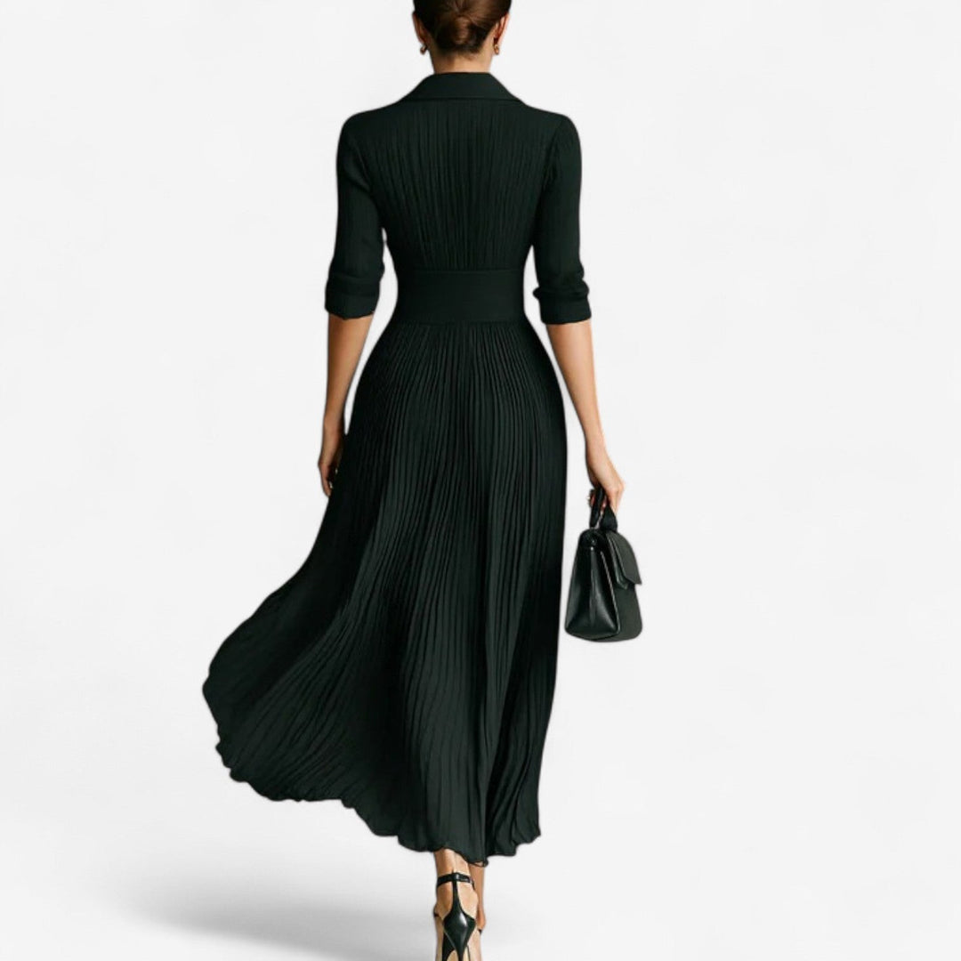 Rear view of black pleated maxi dress with fitted waistband