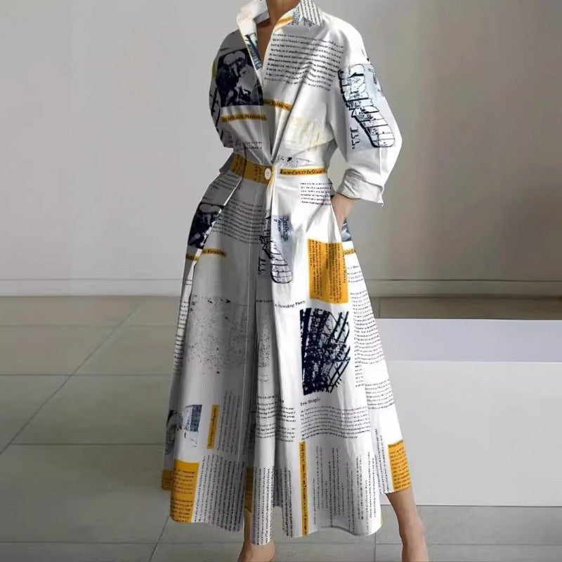 Newspaper print collared maxi dress with cinched waist and full skirt