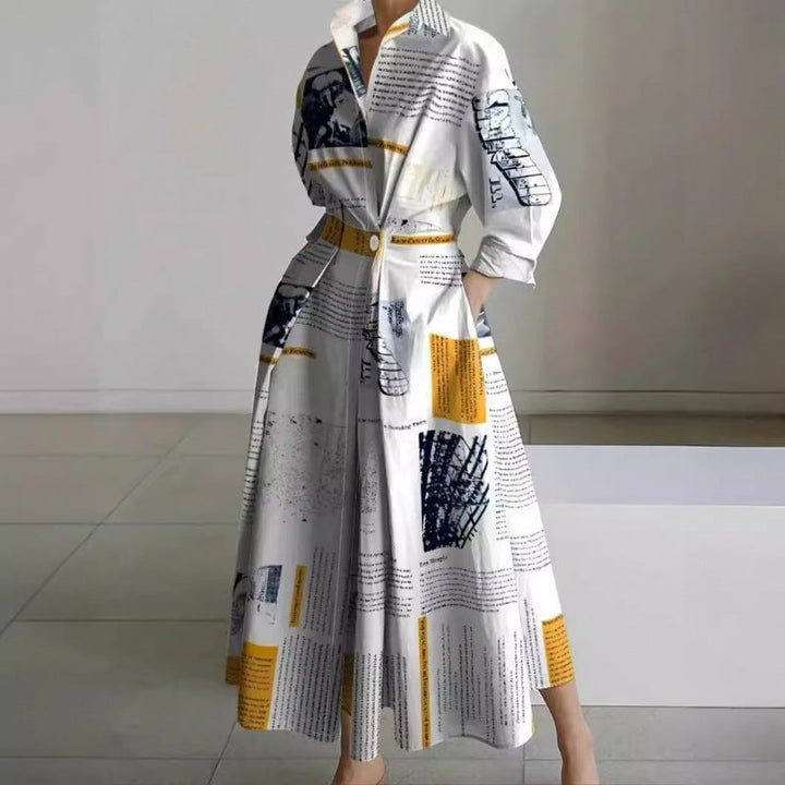 Newspaper print collared maxi dress with cinched waist and full skirt
