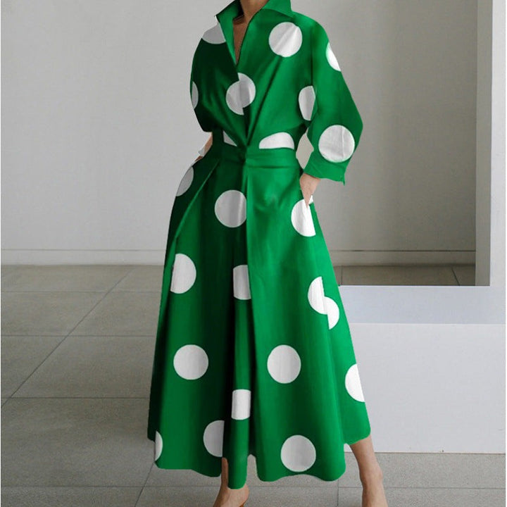 Green maxi dress with large white polka dots and cinched waist