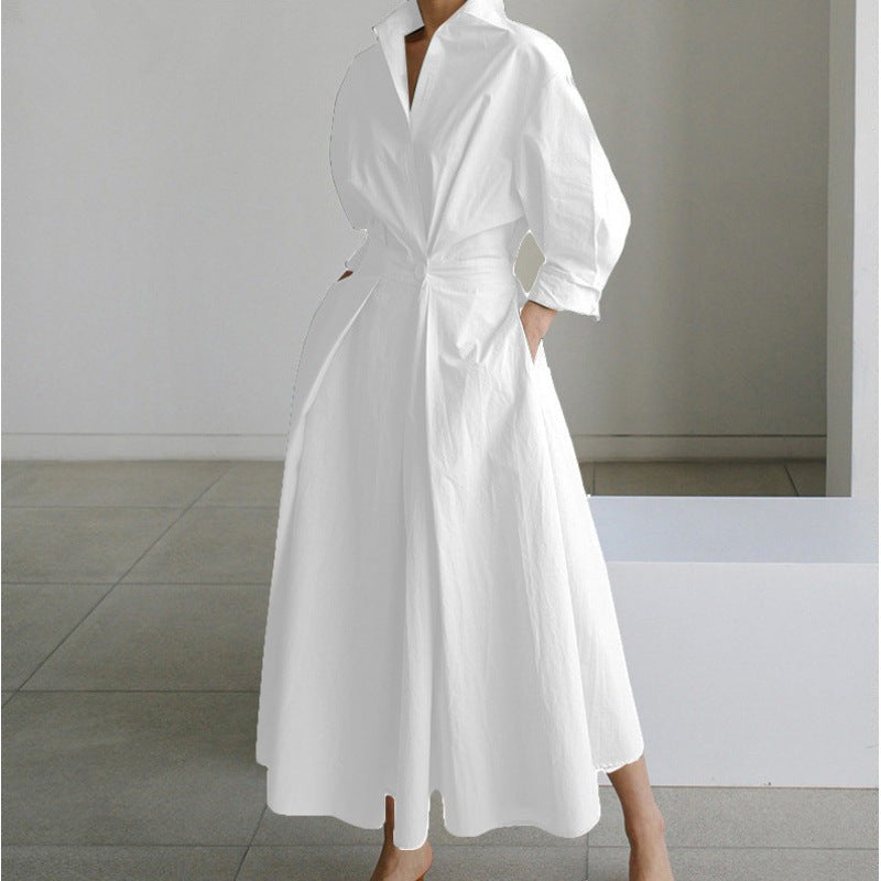 White collared maxi dress with cinched waist and voluminous skirt